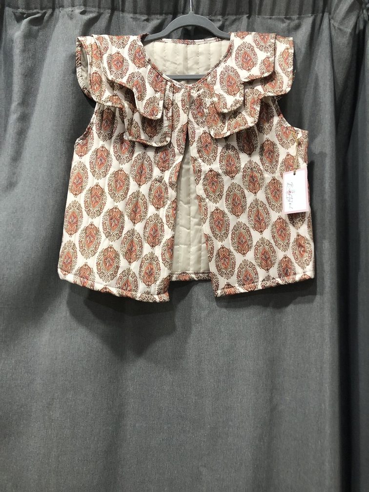 Chaleco estampado tonos marron. Talla unica. Precio 28E